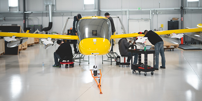 Workers assembling the aircraft